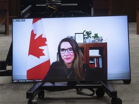 Katie Telford is seen on a television before appearing as a witness before the House of Commons Defence committee in Ottawa, Friday May 7, 2021.