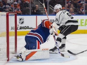 Edmonton Oilers goaltender Stuart Skinner stops Adrian Kempe of the Los Angles Kings on a breakaway during an NHL game at Rogers Place in Edmonton on March 30, 2023.