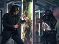 Keanu Reeves, left, in "John Wick: Chapter 4."