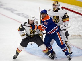 The Edmonton Oilers' Evander Kane (91) battles the Vegas Golden Knights' Ben Hutton (17) during first period NHL action at Rogers Place in Edmonton, Saturday March 25, 2023. Photo by David Bloom