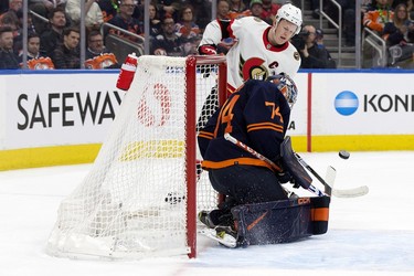 The Edmonton Oilers' goalie Stuart Skinner (74) stops the Ottawa Senators' Brady Tkachuk (7) during second period NHL action at Rogers Place in Edmonton, Tuesday March 14, 2023.