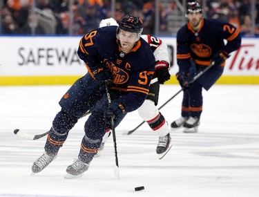 The Edmonton Oilers' Connor McDavid (97) battles the Ottawa Senators during third period NHL action at Rogers Place in Edmonton, Tuesday March 14, 2023. The Oilers won 6-3.