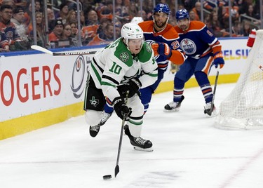 The Edmonton Oilers' Darnell Nurse (25) chases the Dallas Stars' Ty Dellandrea (10) during second period NHL action at Rogers Place in Edmonton, Thursday March 16, 2023.