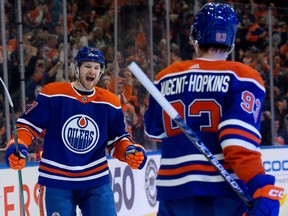 The Edmonton Oilers' Warren Foegele (37) and Ryan Nugent-Hopkins (93) celebrate a goal against the Dallas Stars during first period NHL action at Rogers Place in Edmonton, Thursday March 16, 2023.