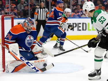 The Edmonton Oilers' goalie Stuart Skinner (74) stops the Dallas Stars' Wyatt Johnston (53) during second period NHL action at Rogers Place in Edmonton, Thursday March 16, 2023.
