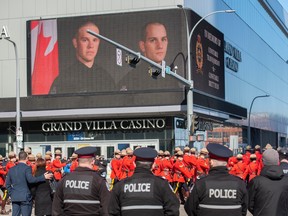 Police and Peace officers march down 104 Ave In Edmonton and up 102 Street into Rogers Place on March 27, 2023.  The regimental funeral  was for Edmonton Police Service constables Travis Jordan and Brett Ryan killed in the line of duty.