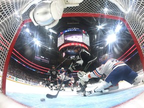 Anze Kopitar of the Los Angeles Kings scores a goal past Stuart Skinner of the Edmonton Oilers, to take a 3-0 lead, during the first period in Game Four of the First Round of the 2023 Stanley Cup Playoffs at Crypto.com Arena on April 23, 2023 in Los Angeles, California.