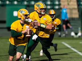 Taylor Cornelius (15) drills with fellow quarterbacks during the first day of Edmonton Elks training camp at Commonwealth Stadium in Edmonton on May 15, 2022.