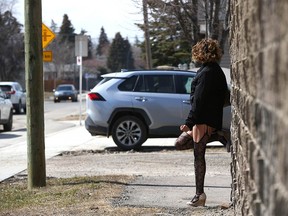 A sex trade worker is shown on 19th Avenue S.E. in Calgary on April 11.