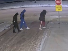 Edmonton police are linking the death of a 20-year-old man to the homicides of a pair found injured in a vehicle about a week earlier. Video surveillance shows the suspect shooter wearing a unique black “Hugo” brand sweatsuit and black Yeezy brand shoes.