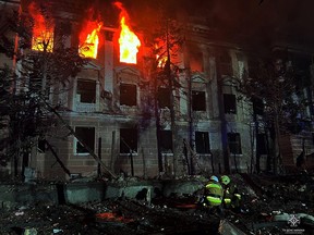Firefighters work on a building damaged by a Russian missile strike in Mykolaiv, Ukraine April 27, 2023.