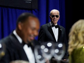 U.S. President Joe Biden wears Aviator sunglasses as Comedian Roy Wood Jr., is introduced during the annual White House Correspondents Association Dinner in Washington, U.S., April 29, 2023.