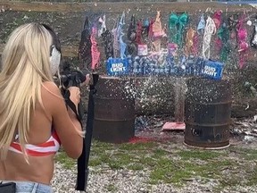 Model Bri Teresi shooting up cans of Bud Light, lingerie and Tampax tampons in protest of woke companies.