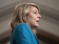 Foreign Affairs Minister Melanie Joly speaks with reporters as she heads to a meeting of cabinet on Parliament Hill in Ottawa, Tuesday, April 25, 2023. Joly says another 50 Canadians were evacuated out of Sudan in the past day.