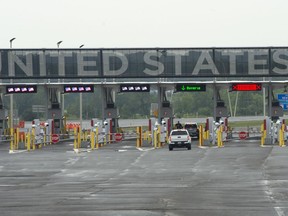 A car heads to the U.S. border crossing, Monday, August 9, 2021 in Lacolle, Que., south of Montreal.