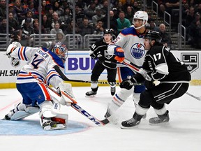 Edmonton Oilers goaltender Stuart Skinner (74) makes a save off a shot by Los Angeles Kings center Zack MacEwen (17) in the second period at Crypto.com Arena.