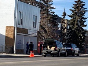 Edmonton homicide detectives investigate a suspicious death at an apartment building near 97 Street between 109A Avenue and 110 Avenue on Saturday, April 8, 2023.