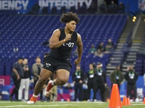 Syracuse offensive lineman Matthew Bergeron runs a drill at the NFL football scouting combine in Indianapolis, Sunday, March 5, 2023.