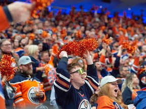 Fans of the Edmonton Oilers, celebrate the first period goal against the Los Angeles Kings at Rogers Place in Edmonton on April 19, 2023.  Photo by Shaughn Butts-Postmedia