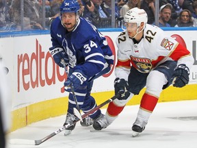 Maple Leafs' Auston Matthews (left) nd Panthers' Gustav Forsling chase the puck during Game 2 of their second-round series in Toronto on May 4, 2023.