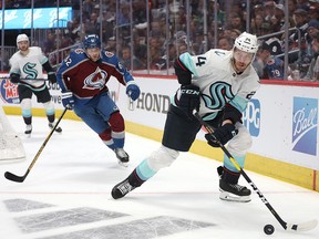 Jamie Oleksiak #24 of the Seattle Kraken brings the puck out from behind the net against the Colorado Avalanche in the second period in Game Seven of the First Round of the 2023 Stanley Cup Playoffs at Ball Arena on April 30, 2023 in Denver, Colorado.