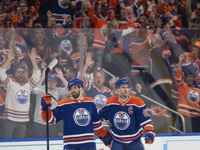 Edmonton Oilers Evan Bouchard (2) and Connor McDavid (97) celebrate a goal against the Vegas Golden Knights in Game 4 of the second round of the NHL playoffs at Rogers Place in Edmonton on May 10, 2023.