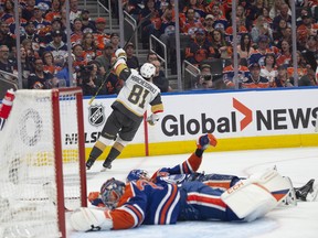 Edmonton Oilers goalie Stuart Skinner (74) and defenceman Darnell Nurse (25) lie on the ice following a goal from Vegas Golden Knights forward Jonathan Marchessault in Game 6 of their second-round playoff series at Rogers Place in Edmonton on Sunday, May 14, 2023.