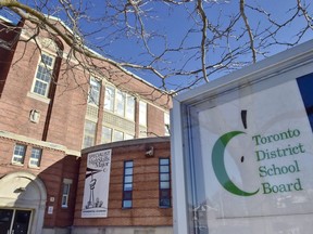 A Toronto District School Board logo is seen on a sign in front of a school in Toronto, Jan. 30, 2018.