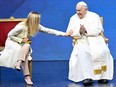 Italy's Prime Minister Giorgia Meloni speaks with Pope Francis during a two-day "General States of Birth" conference in Rome on May 12, 2023.