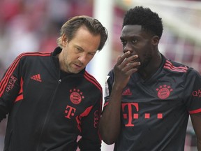 Bayern's Alphonso Davies leaves the pitch after an injury during the German Bundesliga soccer match between 1. FSV Mainz 05 and FC Bayern Munich at the Mewa Arena in Mainz, Germany, Saturday, April 22, 2023. Davies has been voted onto the Bundesliga team of the season.