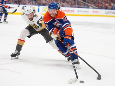 Connor McDavid (97) of the Edmonton Oilers, holds off Mark Stone of the Las Vegas Golden Knights in game four of the second round of the NHL playoffs at Rogers Place in Edmonton on May 10, 2023.