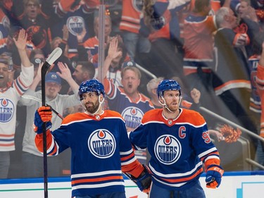 Evan Bouchard (2) and Connor McDavid (97) of the Edmonton Oilers, celebrate after the second goal against  the Las Vegas Golden Knights in game four of the second round of the NHL playoffs at Rogers Place in Edmonton on May 10, 2023.