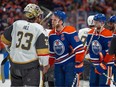 Connor McDavid shakes hands with Adin Hill.