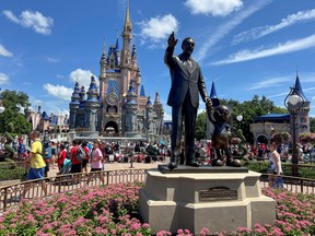 People gather at the Magic Kingdom theme park before the "Festival of Fantasy" parade at Walt Disney World in Orlando, Florida, U.S. July 30, 2022.
