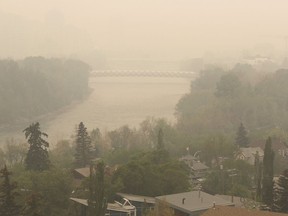 Heavy smoke from northern Alberta forest fires comes south to blanket the Bow River area in downtown Calgary, Tuesday May 16, 2023. Air quality statements continue to blanket much of British Columbia and the Prairie provinces as scores of wildfires rage.