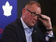 Toronto Maple Leafs GM Brad Treliving adjusts his glasses.