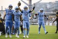 Toronto Argonauts quarterback Chad Kelly celebrates after scoring against the Hamilton Tiger-Cats at BMO Field yesterday. The Argonauts won 32-14. Christopher Katsarov/The Canadian Press