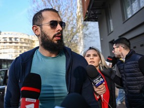 Controversial influencer Andrew Tate arrives at the Directorate for the Investigation of Organized Crime and Terrorism (DIICOT) to attend a hearing on April 10, 2023.