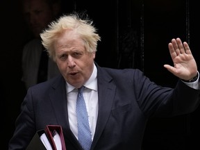 British Prime Minister Boris Johnson leaves 10 Downing Street to attend the weekly Prime Minister's Questions at the Houses of Parliament, in London, on May 25, 2022.