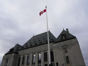 The flag of the Supreme Court of Canada flies on the east flag pole on Monday, Nov. 28, 2022.