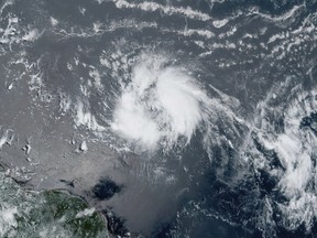 This GeoColor satellite image taken Tuesday, June 20, 2023 and provided by NOAA, shows Tropical Storm Bret as it chugged toward the eastern Caribbean.