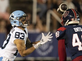Toronto Argonauts wide receiver David Ungerer III makes the catch in the end zone over Alouettes defensive back Kabion Ento during second half CFL football action in Montreal, Friday July 14, 2023.