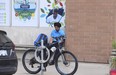 A lone security guard sits outside the South Riverdale Community Health Centre and safe injection site at 955 Queen St. E. on Friday, July 14, 2023.