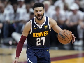 Denver Nuggets guard Jamal Murray (27) gestures during the second half of Game 4 of the basketball NBA Finals against the Miami Heat, Friday, June 9, 2023, in Miami. Murray headlines Canada's extended senior men's basketball team roster.