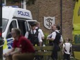 A view of the scene of an incident at a primary school, in Wimbledon, London, Thursday, July 6, 2023. London police say seven children and two adults were injured after a car crashed into an elementary school in Wimbledon in southwest London.