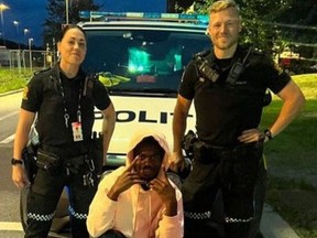 Lil Nas X poses with Oslo police in July 2023.