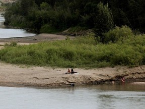 Sunbathers on the Fort Edmonton sandbar in June 2023. Emergency crews are looking for Austin Richmond Laporte, a 20-year-old Beaumont resident swept away by the river near Devon July 16, 2023.