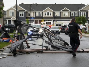 Debris fills the street following a tornado in the Ottawa suburb of Barrhaven on Thursday, July 13, 2023. Following the wreckage of a south-end Ottawa tornado, researchers and contractors are on-site looking into the aftermath that has left several homes uninhabitable.