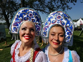 Marina Kozlova, left, and Irons Koutaitseva pose for a photo at the Russian pavilion at the Heritage Festival at Hawrelak Park in August 2014.
