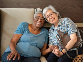 Grandma Ajjie, left, and her friend of forty-two years, both evacuees from Yellowknife, N.W.T., were photographed at the lobby of The Westin Calgary Airport on Monday, Aug. 28.